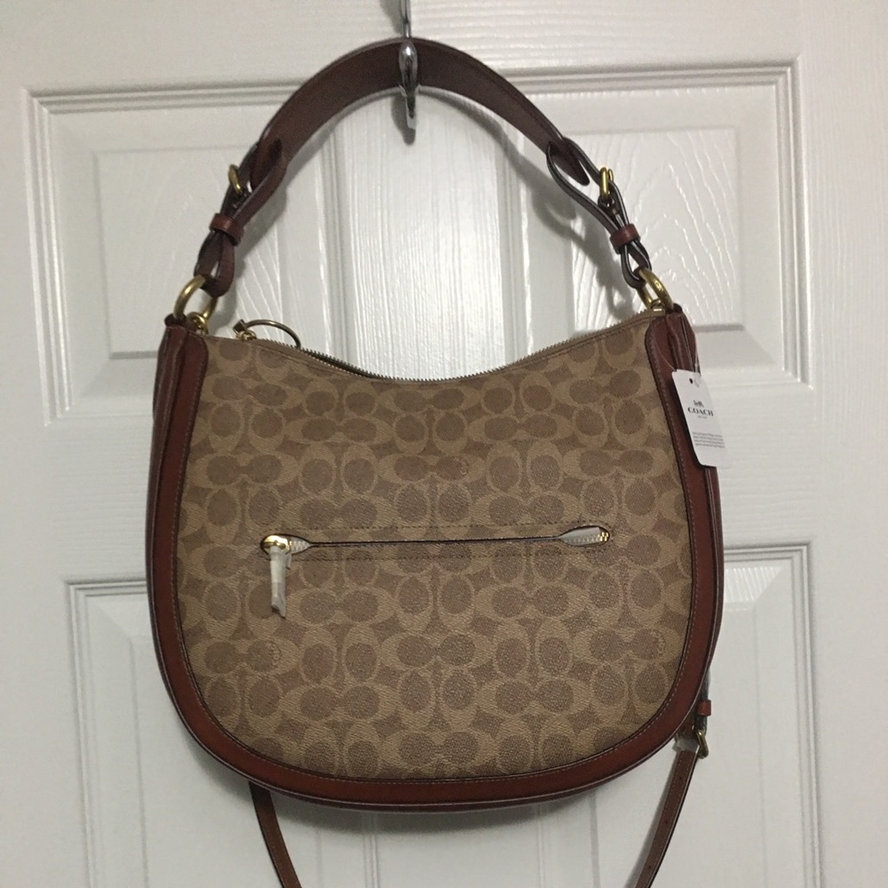 Coach Signature Tan Canvas Leather shoulder bag.